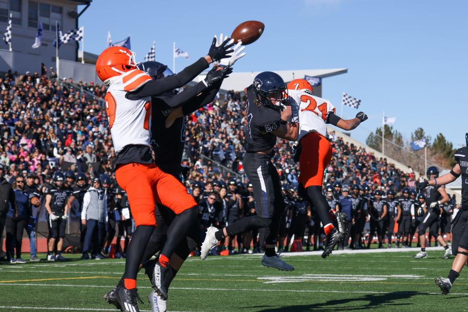 Piedra Vista's Jacob Schreuder (82) intercepts a pass intended for Artesia wide receiver Cayden Joy (19) in the end zone during the second quarter of 5A State championship game at Hutchison Stadium on Saturday, November 26. 