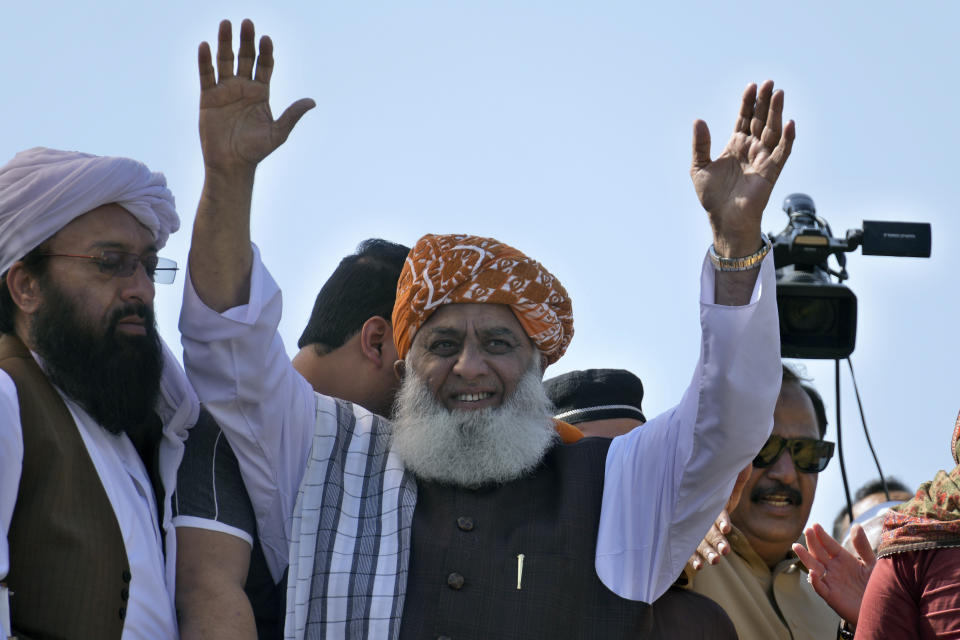 Maulana Fazalur Rehman, leader of Pakistan Democratic Alliance, waves to supporters during a protest outside the Supreme Court, in Islamabad, Pakistan, Monday, May 15, 2023. Thousands of Pakistani government supporters converged on the country's Supreme Court, in a rare challenge to the nation's judiciary. Protesters demanded the resignation of the chief justice over ordering the release of former Prime Minister Imran Khan. (AP Photo/Anjum Naveed)
