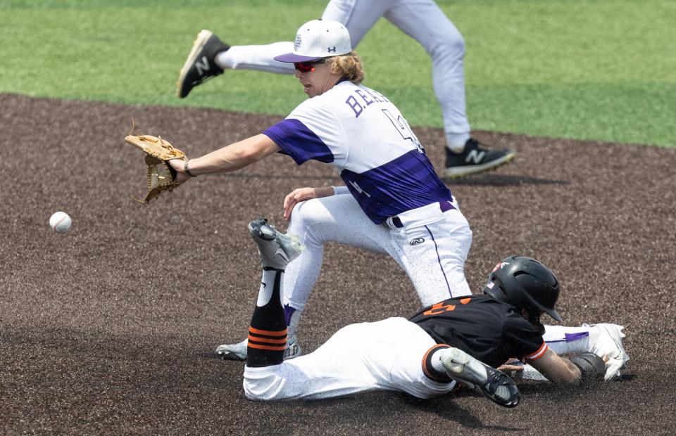 Massillon's Tyler Hackenbracht steals second base in the second inning as Jackson's Kyle Andrews fields the throw during their Division I district semifinal at Munson Stadium on Tuesday, May 23, 2023