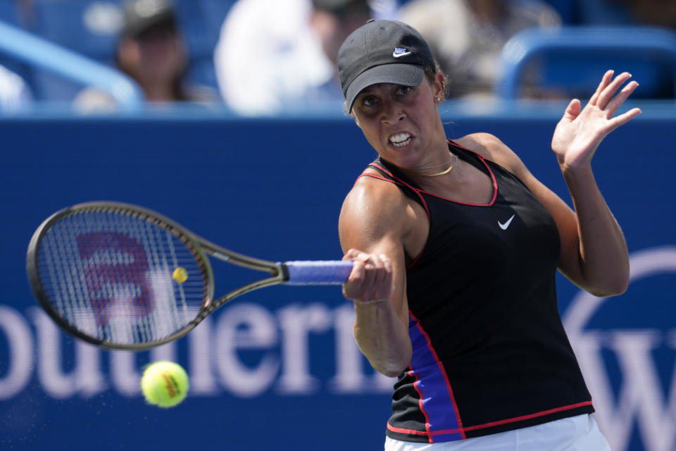 Madison Keys, of the United States, returns a shot to Elena Rybakina, of Kazakhstan, during the Western & Southern Open tennis tournament Friday, Aug. 19, 2022, in Mason, Ohio. (AP Photo/Jeff Dean)