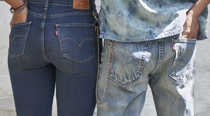 Two people where Jeans. One shows a Levi's Red Tab.