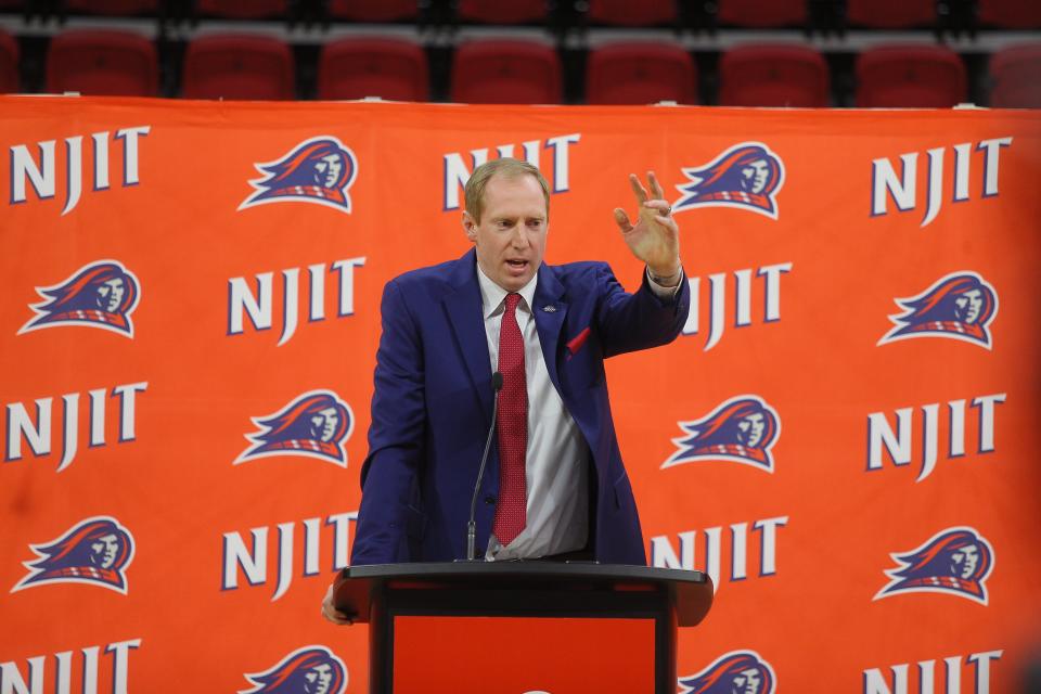 New NJIT basketball coach Grant Billmeier (left) speaking at his introductory press conference