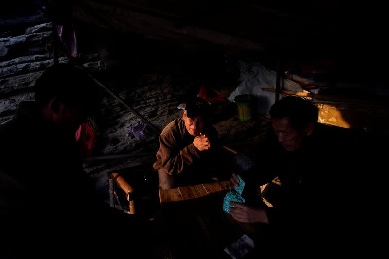 The Wider Image: Fishermen cry foul as China bids to fix drought-hit lake