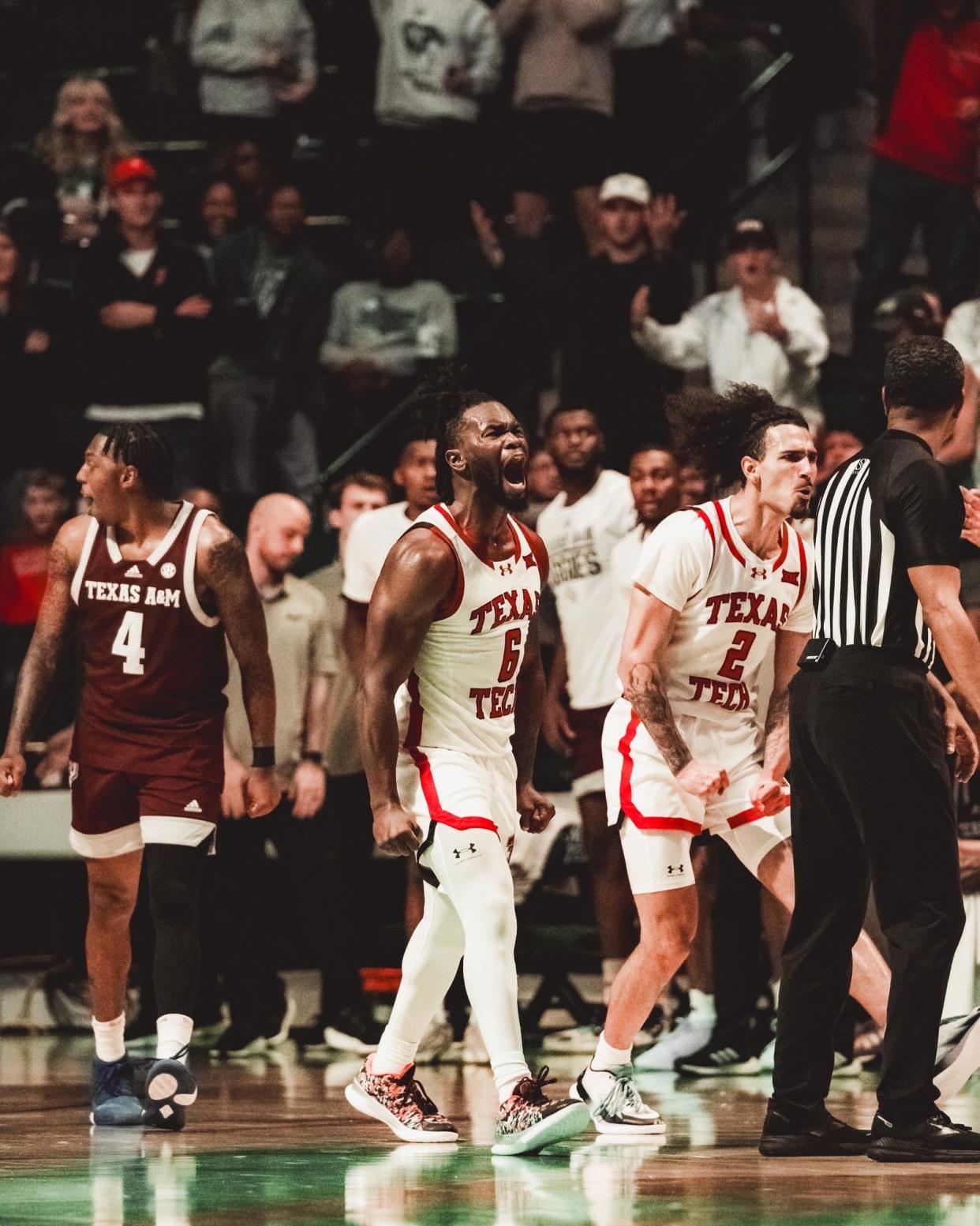 Texas Tech players Joe Toussaint (6) and Pop Isaacs react in their exhibition basketball game against Texas A&M, Sunday, Oct. 29, 2023 in the Super Pit at Denton.