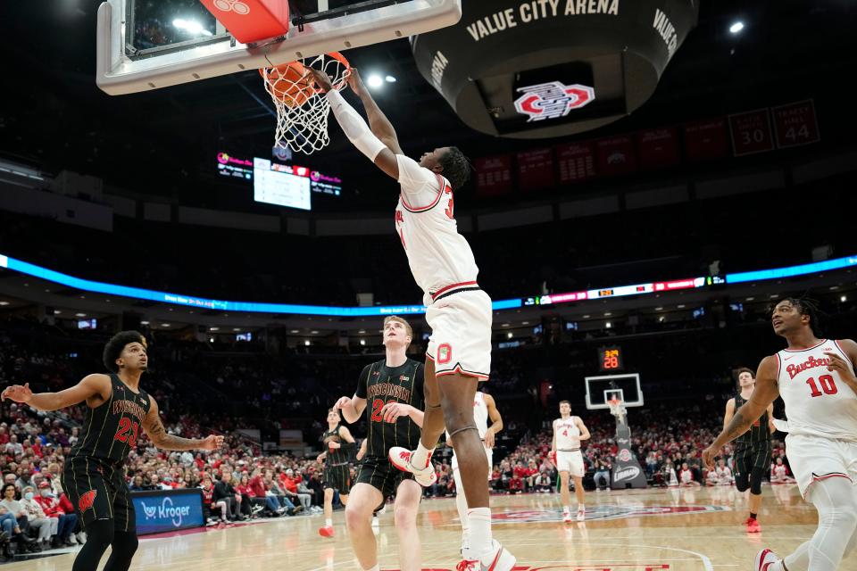 Feb 2, 2023; Columbus, OH, USA;  Ohio State Buckeyes center Felix Okpara (34) dunks over Wisconsin Badgers forward Steven Crowl (22) during the first half of the NCAA men’s basketball game at Value City Arena. Mandatory Credit: Adam Cairns-The Columbus Dispatch