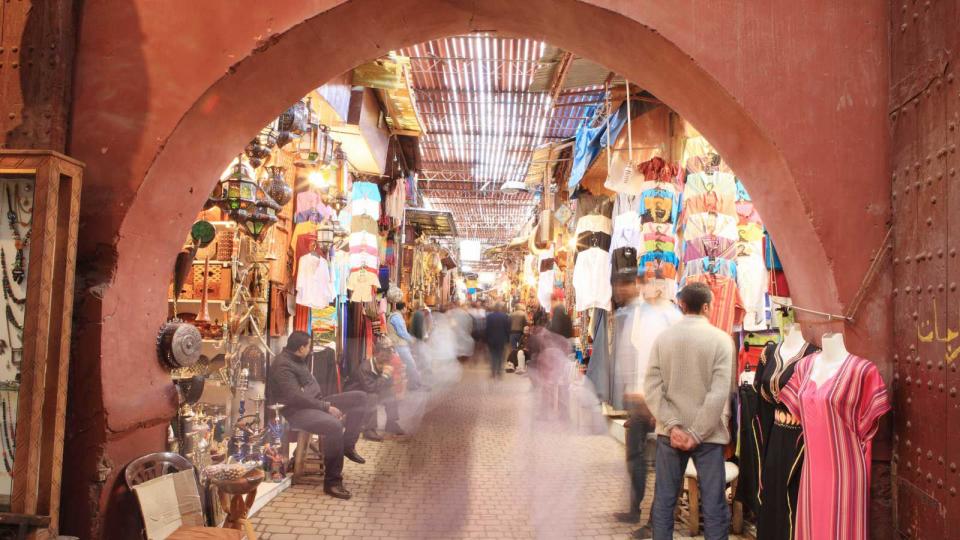 Morocco, Marrakech. Shoppers in medina