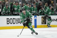 Dallas Stars center Wyatt Johnston skates with the puck against the Vegas Golden Knights during the first period in Game 2 of an NHL hockey Stanley Cup first-round playoff series in Dallas, Wednesday, April 24, 2024. (AP Photo/Tony Gutierrez)