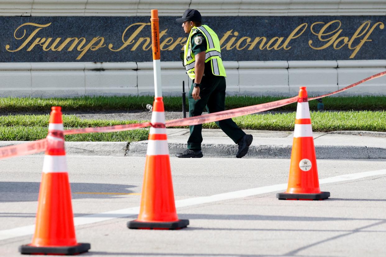 A law enforcement officer walks after reports of shots fired outside Republican presidential nominee and former U.S. President Donald Trump's Trump International Golf Course in West Palm Beach, Florida on September 15, 2024.