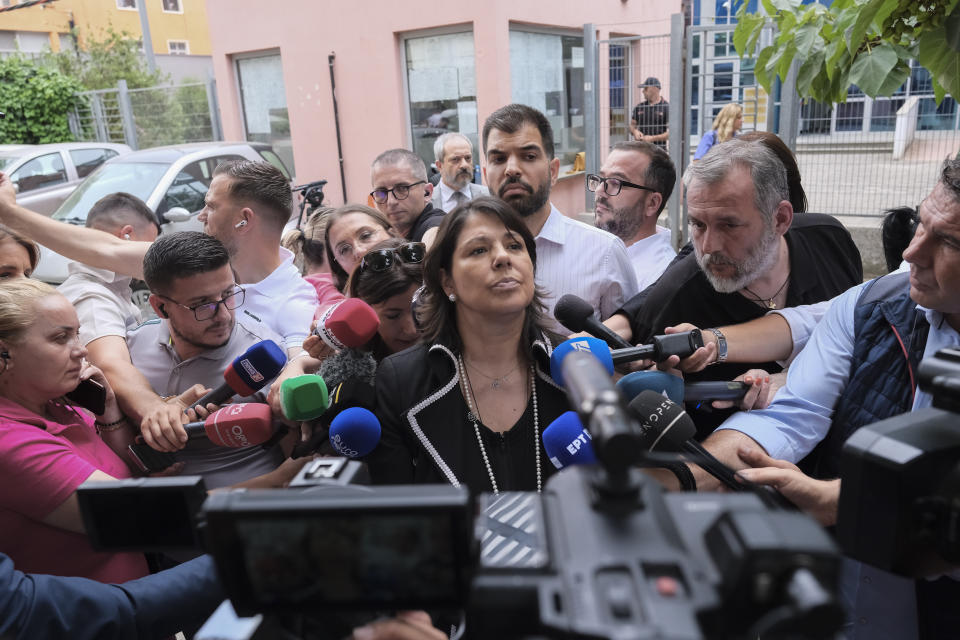 Greek ambassador to Tirana Konstantina Kamitsi speaks to the press outside a court in Tirana, Albania, on Tuesday, June 25, 2024. An Albanian appeals court on Tuesday upheld a two-year prison sentence for an elected mayor of the country's Greek minority, in a move expected to further exacerbate tension with neighboring Greece. The appeals court declined to change the verdict of the court of first instance in March on Dhionisios Alfred Beleris, 51, who was imprisoned on charges of vote-buying in municipal elections last year.(AP Photo/Vlasov Sulaj)