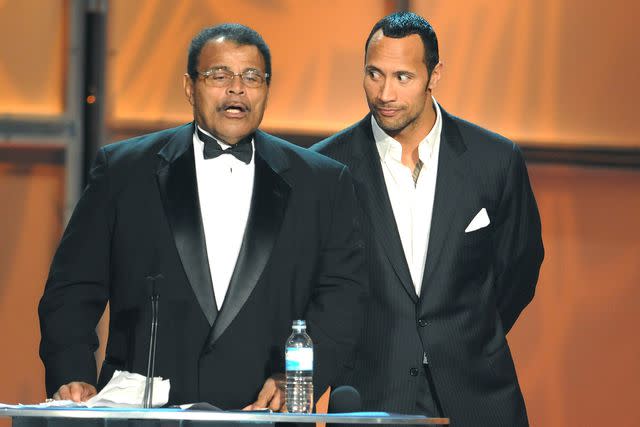 <p>MediaPunch/Shutterstock</p> Rocky Johnson and Dwayne Johnson during the 2008 WWE Hall of Fame on March 29, 2008.