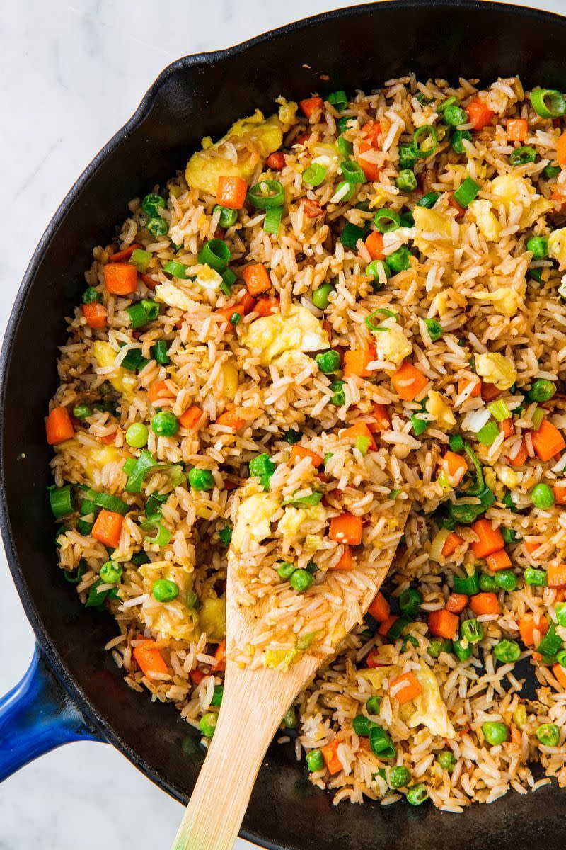 <p>Fried rice is a dish we turn to again, and again because it's not only super easy to make, but also SO adaptable based on what ingredients are hanging out in your fridge. </p><p>Get the <a href="https://www.delish.com/uk/cooking/recipes/a30413128/how-to-make-fried-rice/" rel="nofollow noopener" target="_blank" data-ylk="slk:Perfect Fried Rice;elm:context_link;itc:0;sec:content-canvas" class="link ">Perfect Fried Rice</a> recipe.</p>