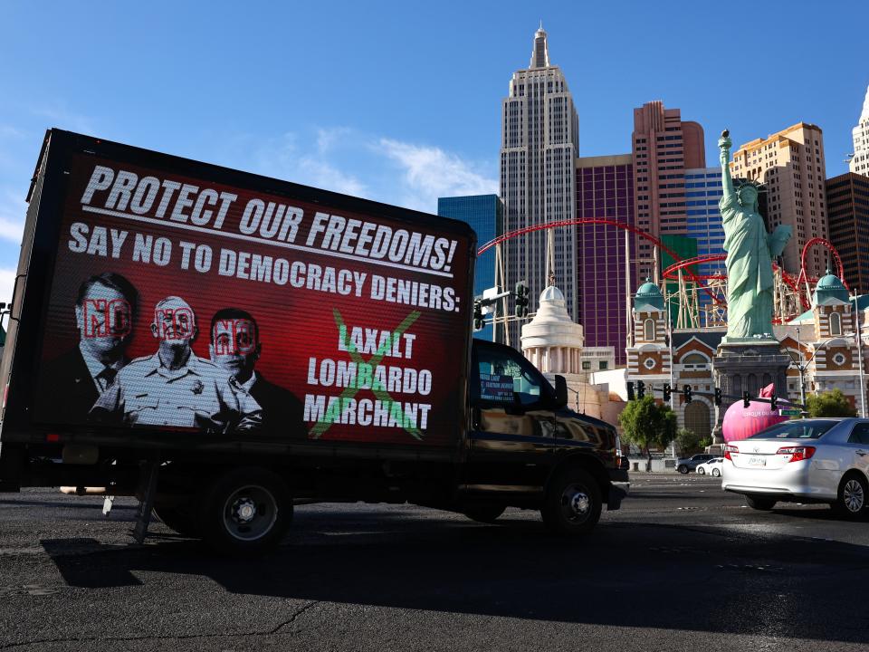 A mobile billboard drives along the Las Vegas Strip denouncing Nevada Republican candidates Adam Laxalt, Joe Lombardo, and Jim Marchant on November 4, 2022.