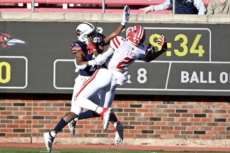 Louisiana-Lafayette wide receiver Kyren Lacy (2) can't hold on to a pass as UTSA cornerback Ken Robinson (21) defends in the second quarter during the First Responder Bowl NCAA college football game in Dallas, Saturday, Dec. 26, 2020. (AP Photo/Matt Strasen)