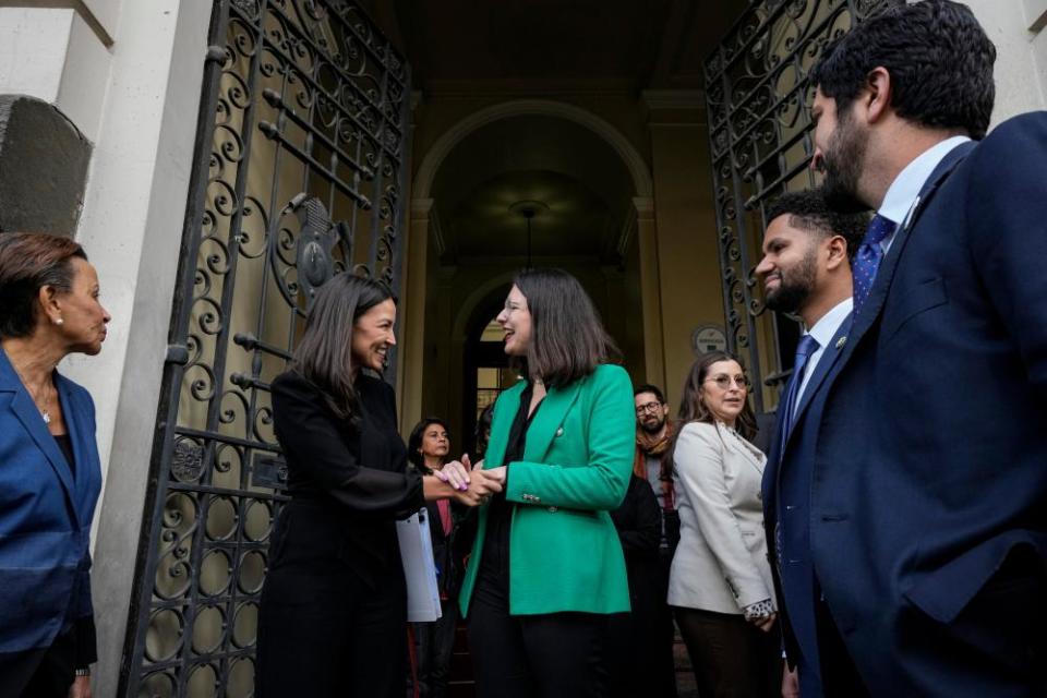 Ocasio-Cortez shakes hands with Mayor Iraci Hassler in Santiago, Chile on 17 August 2023.