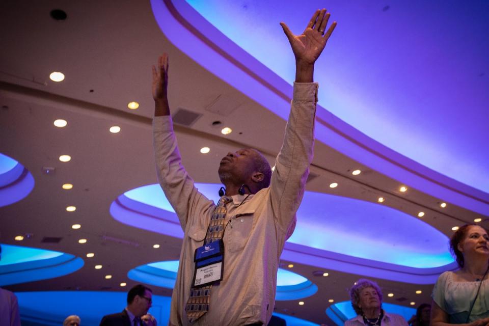 A delegate prays at the Road to Majority conference. Many evangelicals are expected to support Trump once again in November’s election (Bel Trew)