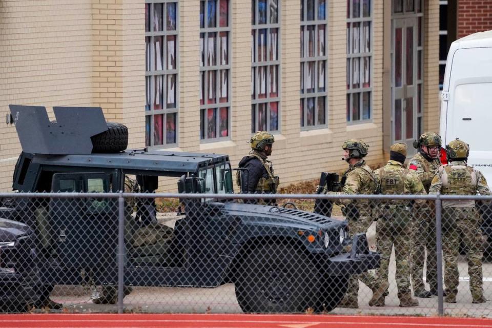 Law enforcement teams stage near Congregation Beth Israel, at 6100 Pleasant Run Road on Saturday, Jan. 15, 2022, in Colleyville, Texas. Authorities said a man who took hostages during services at the synagogue died as law enforcement raided the building after the hostages escaped.