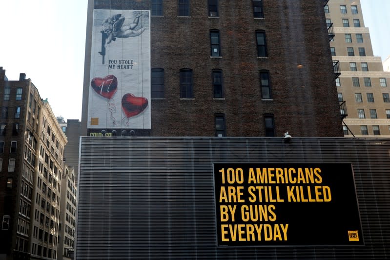 FILE PHOTO: A "wall of Demand" mural and video message created by Manuel Oliver is seen one year anniversary of the school shooting in Parkland Florida in New York