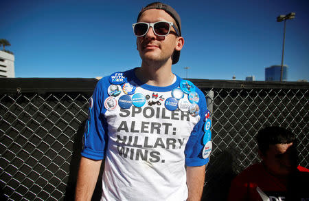 A protestor wears a shirt in support of U.S. Presidential candidate Hillary Clinton at the Wall of Tacos demonstration in front of the Trump International Hotel Las Vegas before the last 2016 U.S. presidential debate in Las Vegas, Nevada, U.S., October 19, 2016. REUTERS/Jim Urquhart