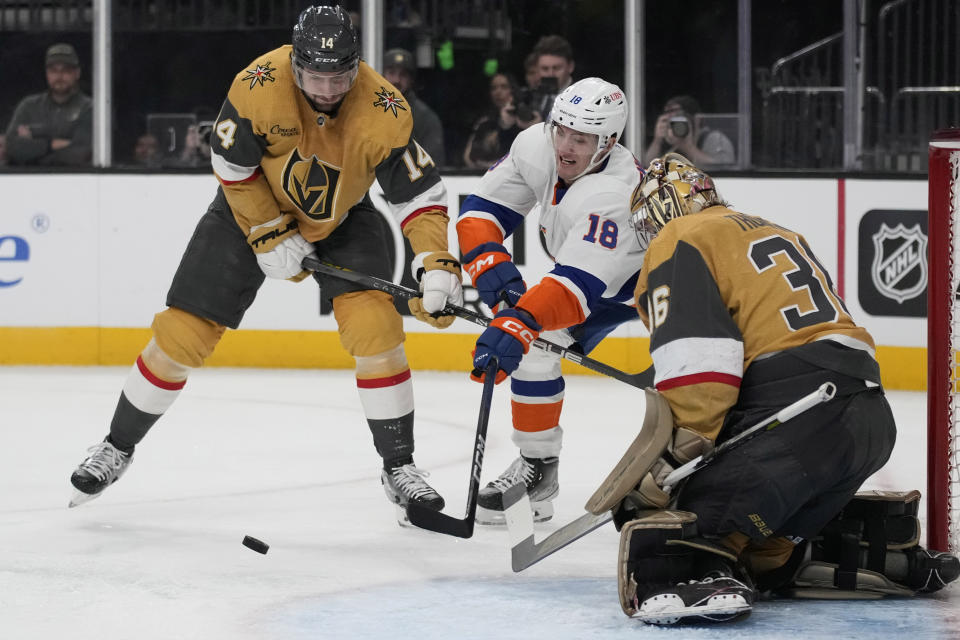 New York Islanders left wing Pierre Engvall (18) attempts a shot on Vegas Golden Knights goaltender Logan Thompson (36) during the first period of an NHL hockey game Saturday, Jan. 6, 2024, in Las Vegas. (AP Photo/John Locher)