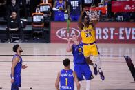 Denver Nuggets' Jamal Murray, left, Michael Porter Jr. (1) and Nikola Jokic (15) defend as Los Angeles Lakers' Dwight Howard (39) dunks the ball during the second half an NBA conference final playoff basketball game, Friday, Sept. 18, 2020, in Lake Buena Vista, Fla. (AP Photo/Mark J. Terrill)