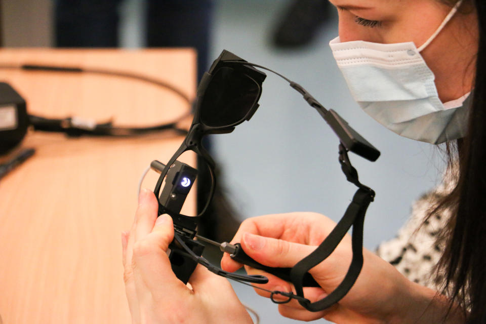 The bionic chip works in conjunction with special glasses to allow the patient to receive signals in their blind eye (Moorfields Eye Hospital/PA)