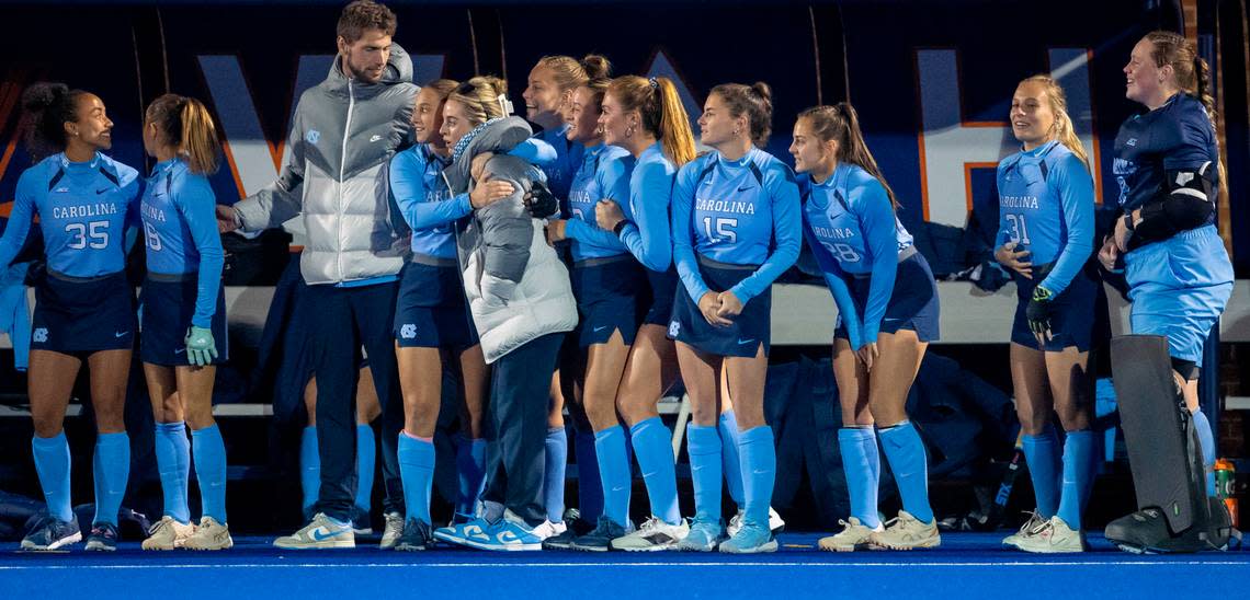 North Carolina’s Kennedy Cliggett (36) embraces coach Erin Matson as they watch the closing seconds of their 2-0 victory against Duke in the ACC Championship on Friday, November 3, 2023 in Charlottesville, Va. The Tar Heels claimed their seventh consecutive ACC Championship, and the first for Matson as head coach.