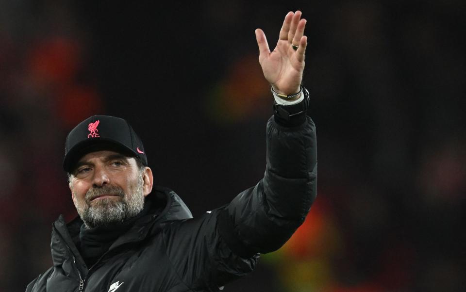  Liverpool's German manager Jurgen Klopp celebrates at the end of the UEFA Champions League quarter final second leg football match between Liverpool and Benfica at the Anfield stadium, in Liverpool, on April 13, 2022. - Liverpool and Benfica scored three goals each but Liverpool is qualified for the semi-finals. - AFP