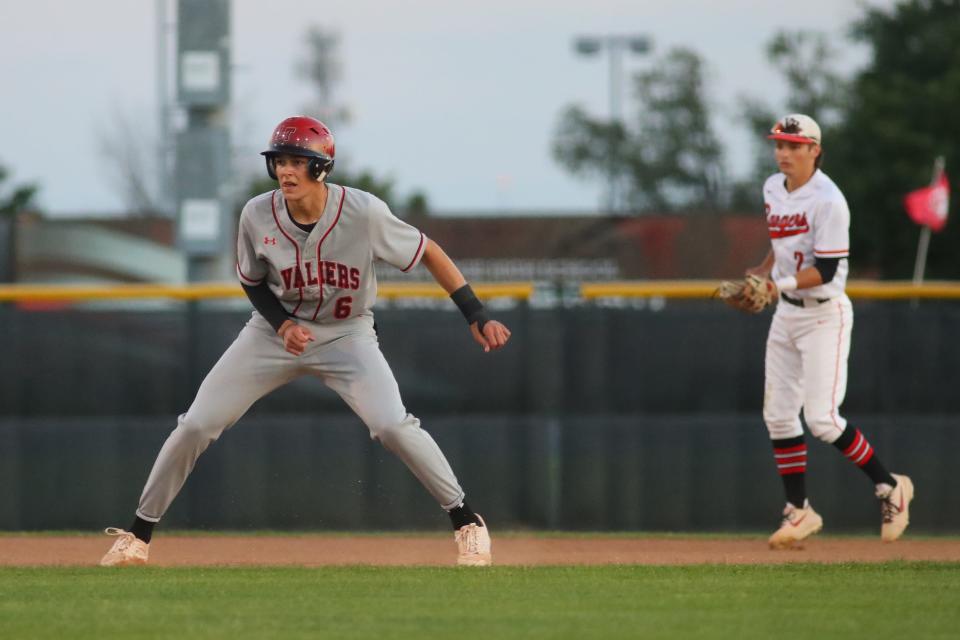Lake Travis' Kaeden Kent, leading off in front of Vista Ridge's Owen Groch during a game last season, leads the Cavaliers with a .449 batting average. He has only struck out four times in 115 plate appearances this year.