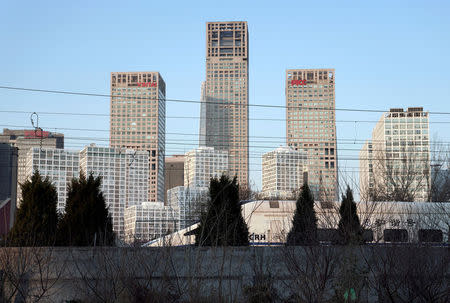 A CRH (China Railway High-speed) bullet train runs past Beijing's central business area, China December 13, 2017. REUTERS/Jason Lee