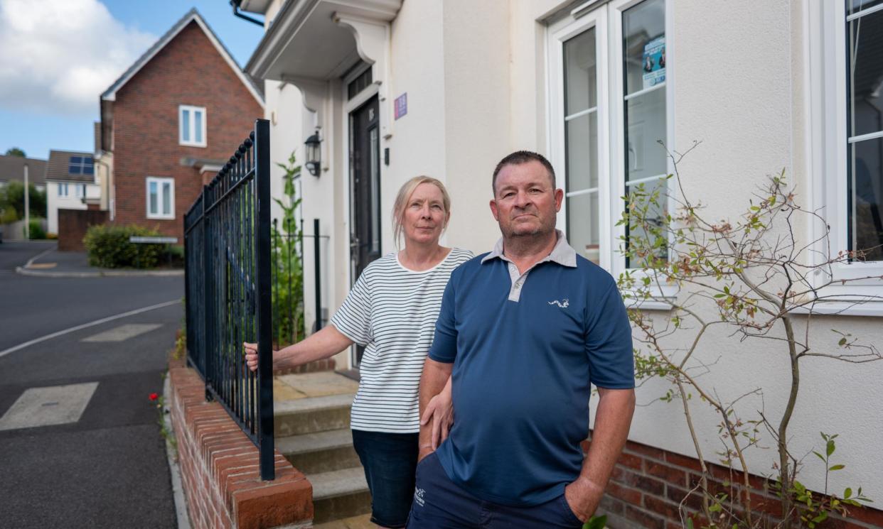 <span>Dayle Dixon and Mark Lee have an extensive paper trail of their complaints about their house in Devon.</span><span>Photograph: Jim Wileman/The Guardian</span>