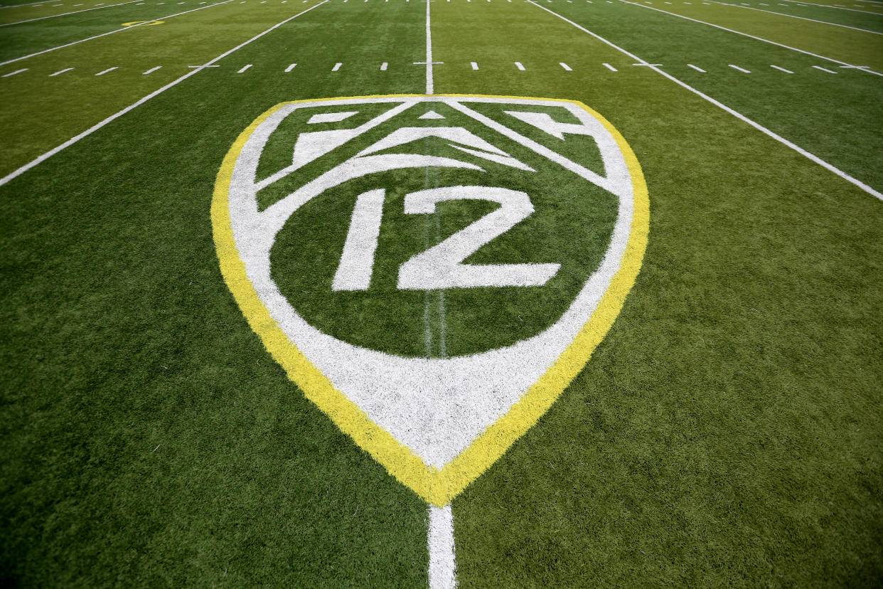 A PAC-12 logo is seen painted on the field before an NCAA college football game between Washington State and Oregon Saturday, Oct. 10, 2015, in Eugene, Ore. (AP Photo/Ryan Kang)