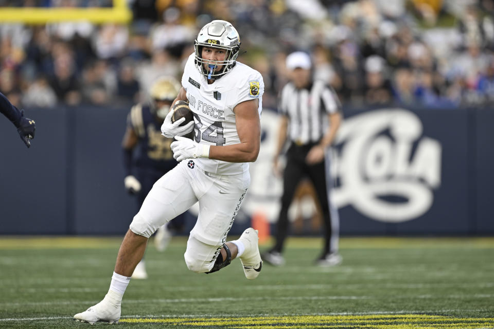 Air Force tight end Caleb Rillos (84) runs with the ball after making a catch during the first half of an NCAA college football game against Navy, Saturday, Oct. 21, 2023, in Annapolis, Md. (AP Photo/Terrance Williams)