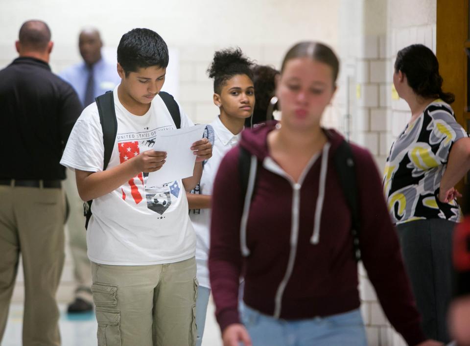 Back in 2018, a freshman looks over his class schedule in the hallway as the freshmen class at Newark High School get tours of their new school before the upperclassmen join them.