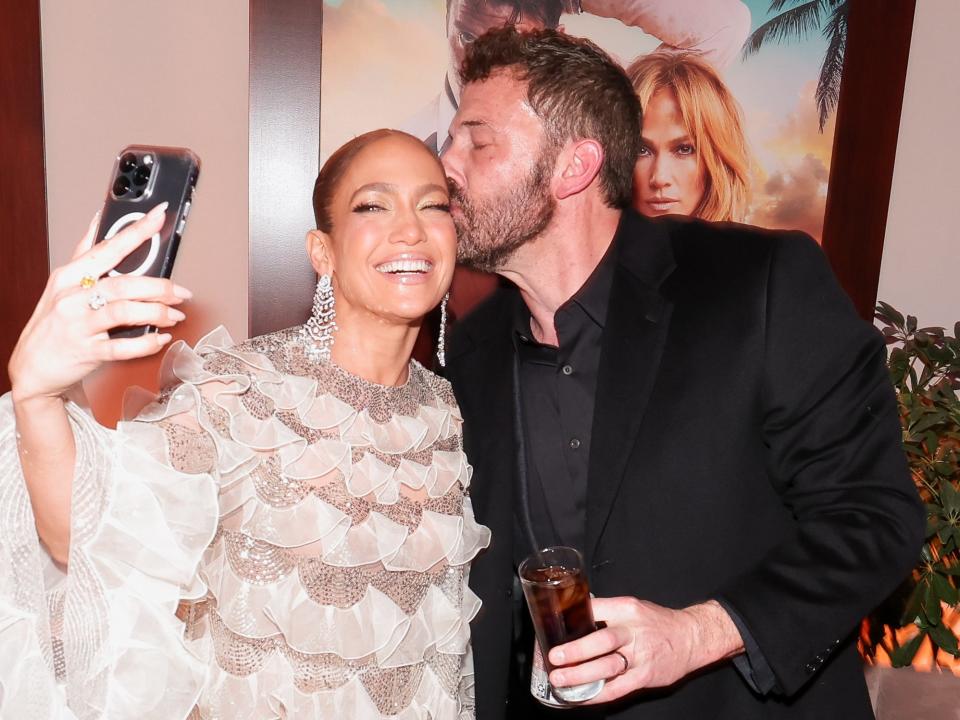 Jennifer Lopez and Ben Affleck posing for a selfie at the premiere of "Shotgun Wedding" in January 2023.