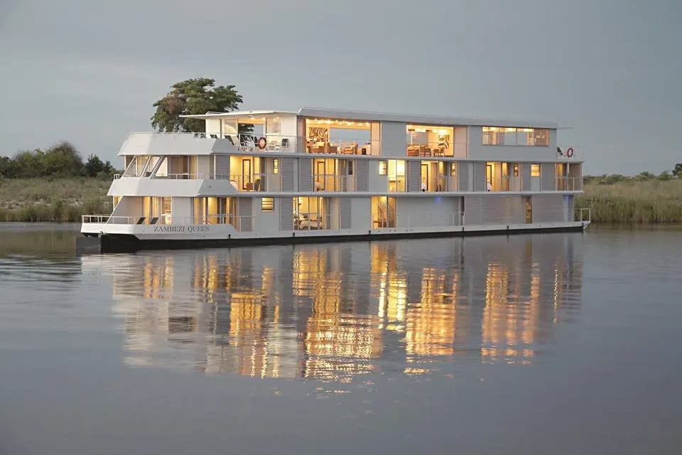 A big white houseboat known as the Zambezi Queen offers boating safaris in Botswana. It's one of the coolest boating experiences in the world.