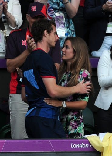 Andy Murray (L) embraces his girlfriend Kim Sears after beating Switzerland's Roger Federer in their men's tennis singles final at the London Olympics on August 5. Before heading to the Toronto Masters, Murray plans to enjoy a long night's celebration with Sears, his family and backroom staff