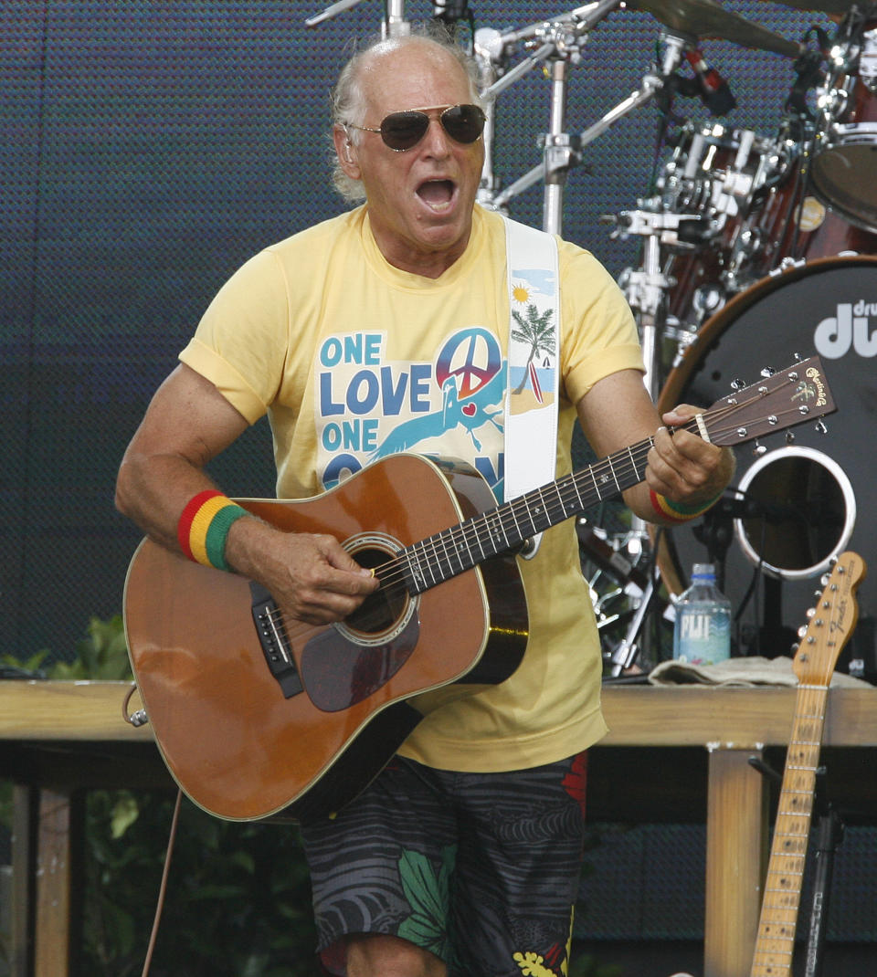 FILE - Jimmy Buffett performs Sunday, July 11, 2010 in Gulf Shores, Ala. Buffett, who popularized beach bum soft rock with the escapist Caribbean-flavored song “Margaritaville” and turned that celebration of loafing into an empire of restaurants, resorts and frozen concoctions, has died, Friday, Sept. 1, 2023. (Chip English/Press-Register via AP, File)