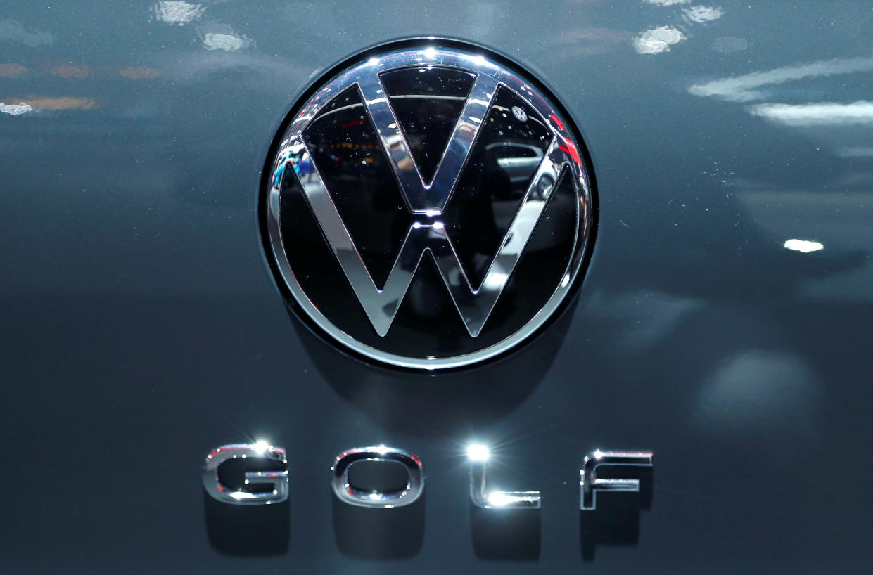 The logo of German carmaker Volkswagen is seen on a new Golf car