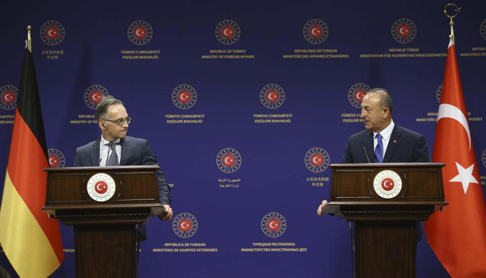 Turkey's Foreign Minister Mevlut Cavusoglu, right, and German counterpart Heiko Maas speak to the media after their talks, in Ankara, Turkey, Tuesday, Aug. 25, 2020. Germany’s foreign minister appealed to NATO allies Greece and Turkey to deescalate military tensions in the eastern Mediterranean, warning Tuesday that “any spark, however small, could lead to a disaster.” (Fatih Aktas/Turkish Foreign Ministry via AP, Pool)