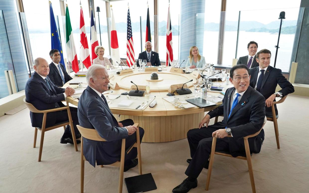 Clockwise from left, U.S. President Joe Biden, Germany's Chancellor Olaf Scholz, Britain's Prime Minister Rishi Sunak, European Commission President Ursula von der Leyen, President of the European Council Charles Michel, Italy's Premier Giorgia Meloni, Canada's Prime Minister Justin Trudeau, France's President Emmanuel Macron and Japan's Prime Minister Fumio Kishida attend a meeting during the G7 Leaders' Summit in Hiroshima, western Japan Friday, May 19, 2023. (Japan Pool via AP)