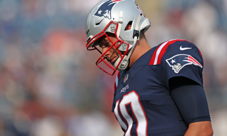 Patriots quarterback Mac Jones on the field.