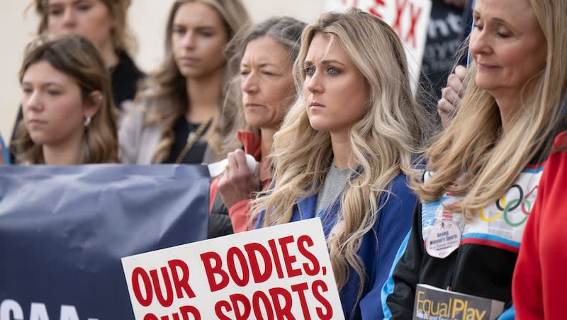 Former University of Kentucky swimmer Riley Gaines, second from right, stands during a rally on Thursday, Jan. 12, 2023, outside of the NCAA Convention in San Antonio. Gaines was among more than a dozen college athletes who filed a lawsuit against the NCAA on Thursday, March 14, 2023, accusing it of violating their Title IX rights by allowing Lia Thomas to compete at national championships in 2022.