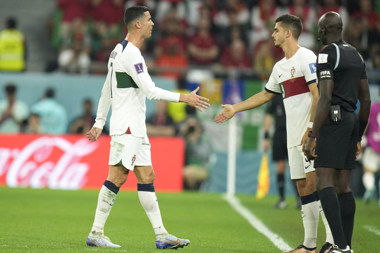 Portugal's Cristiano Ronaldo, left, leaves the pitch to be substituted by Portugal's Andre Silva, right, during the World Cup group H soccer match between South Korea and Portugal, at the Education City Stadium in Al Rayyan , Qatar, Friday, Dec. 2, 2022. (AP Photo/Francisco Seco)