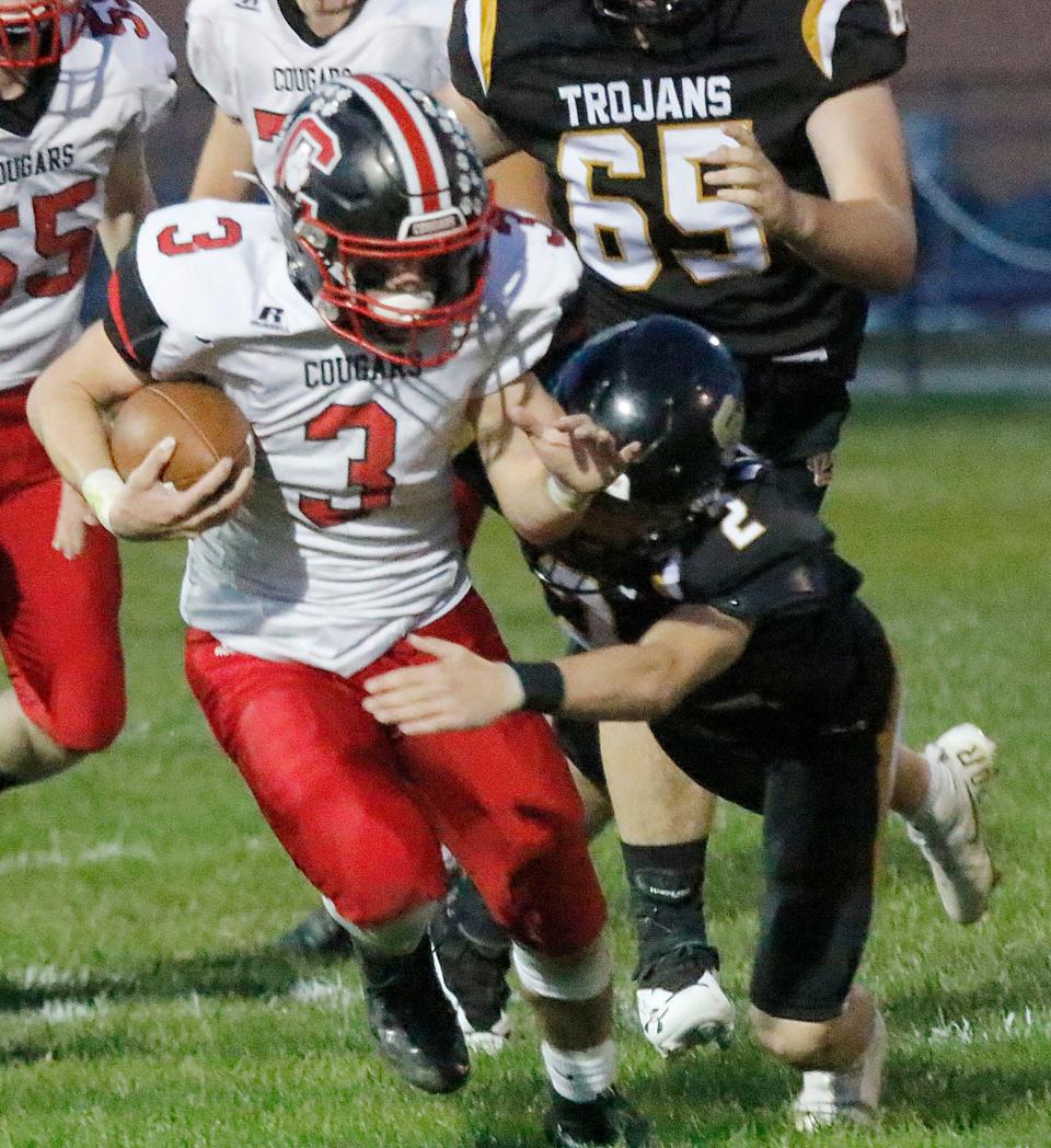 Crestview High School's Connor Morse (3) is tackled by South Central High School's Aaron Hauler (2) during high school football action Friday, Oct. 1, 2021 at South Central High School. TOM E. PUSKAR/TIMES-GAZETTE.COM