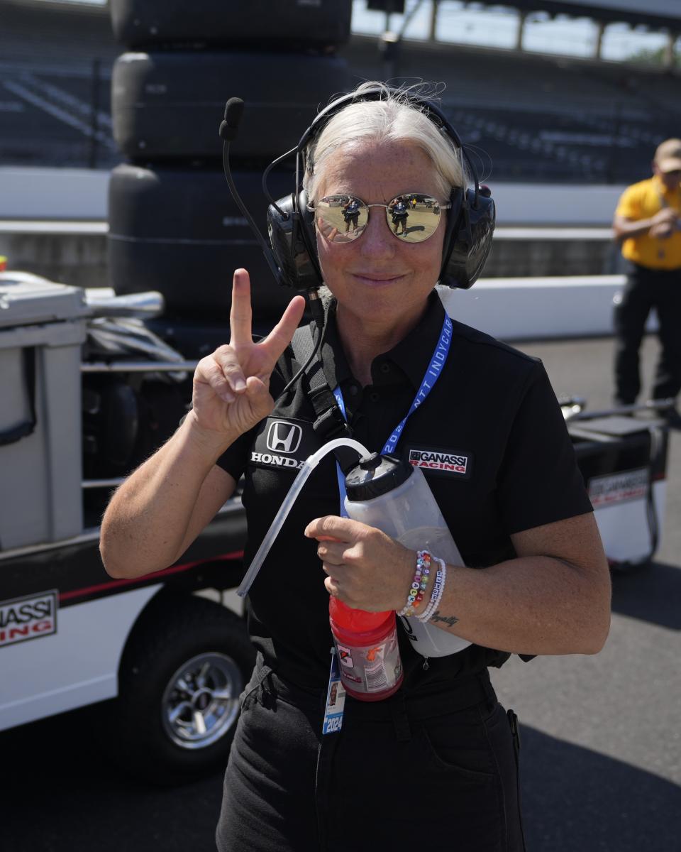 Angela Cullen stands on pit lane during qualifications for the Indianapolis 500 auto race at Indianapolis Motor Speedway, Saturday, May 18, 2024, in Indianapolis. Cullen, the former trainer for Lewis Hamilton, is now working with Ganassi driver Marcus Armstrong, of New Zealand. (AP Photo/Darron Cummings)