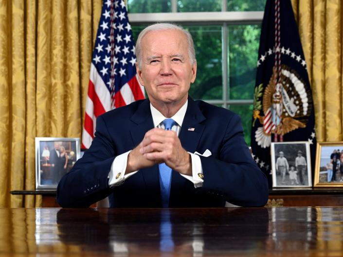 Biden at the desk in the Oval Office
