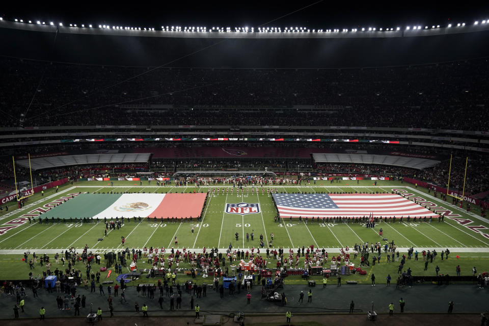 Flags for Mexico and the United States are seen on the field before an NFL football game between the Arizona Cardinals and the San Francisco 49ers Monday, Nov. 21, 2022, in Mexico City. (AP Photo/Eduardo Verdugo)