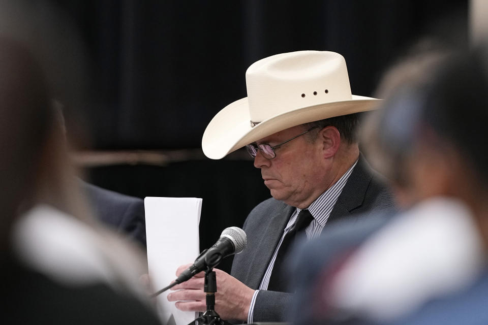 Jesse Prado, an Austin-based investigator, right, attends a special city council meeting to share his findings in Uvalde, Texas, Thursday, March 7, 2024. Almost two years after the deadly school shooting in Uvalde that left 19 children and two teachers dead, the city council met to discuss the results of an independent investigation it requested into the response by local police officers. (AP Photo/Eric Gay)