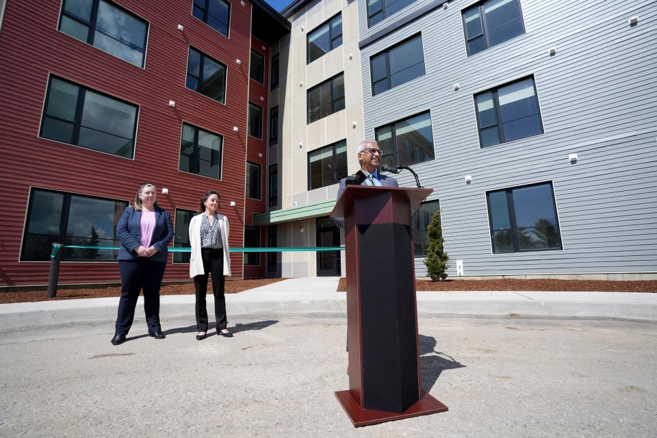 Dr. Sunny Eappen, president and chief executive officer of the UVM Health Network, makes some remarks prior to opening the apartment building at 303 Market St. in South Burlington on April 28, 2023. Standing behind Eappen are Jesse Baker, city manager, on the left, and Becky Kapsalis, assistant vice president of talent acquisition for the UVM Health Network.