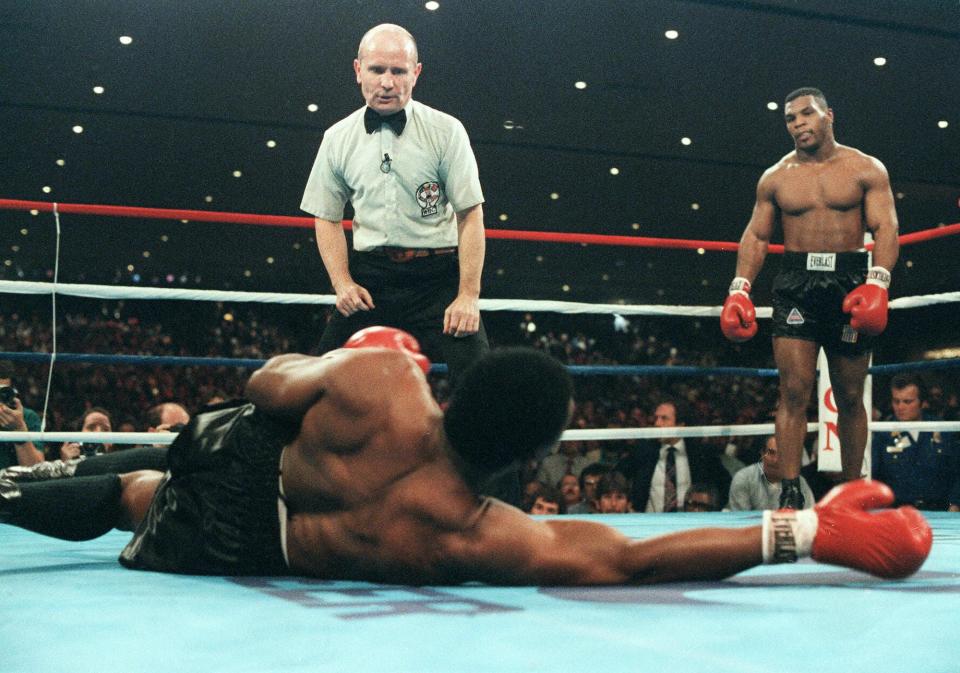 Mike Tyson knocks Trevor Berbick out in the second round to become the youngest heavyweight champion in history.